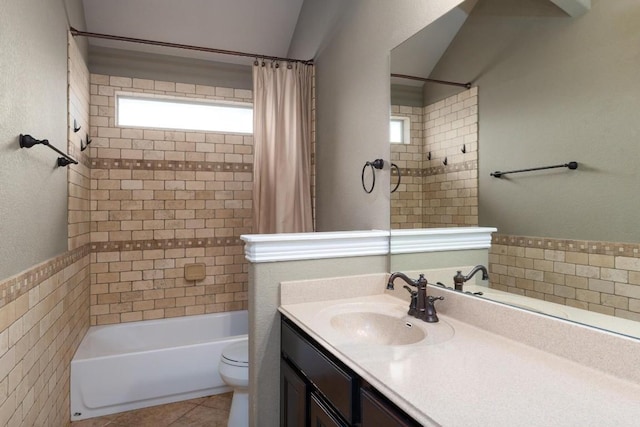 974 Clear Springs Holw, Buda, TX 78610 - full bathroom with vanity, shower / bath combo, toilet, tile patterned flooring, and lofted ceiling