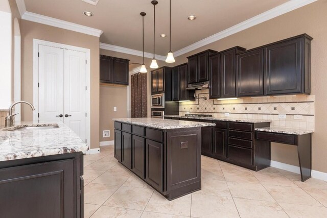 974 Clear Springs Holw, Buda, TX 78610 - kitchen with a sink, stainless steel microwave, decorative backsplash, ornamental molding, and a kitchen island