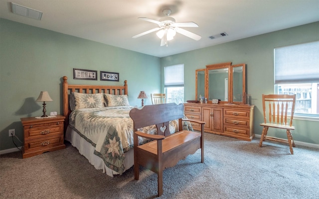 bedroom with ceiling fan and carpet flooring