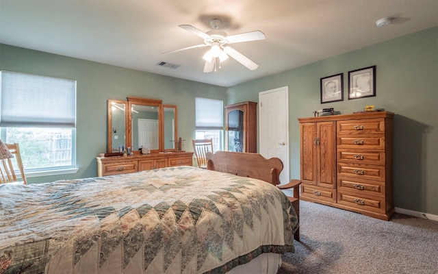 bedroom featuring ceiling fan and light carpet