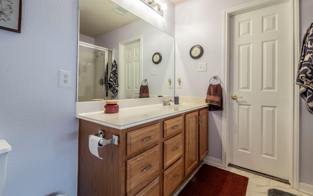 bathroom featuring vanity and walk in shower