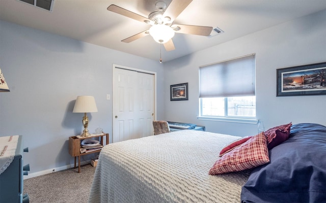 carpeted bedroom with a closet and ceiling fan