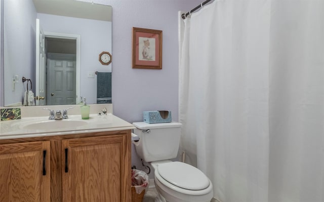 bathroom with toilet and vanity