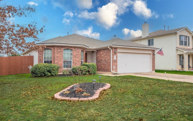 view of front of home with a front yard and a garage