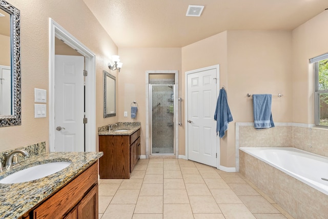 bathroom featuring vanity, tile patterned floors, and independent shower and bath