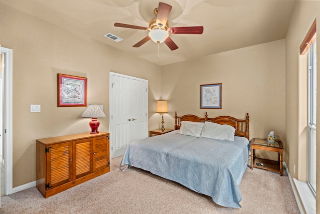 carpeted bedroom with a closet and ceiling fan