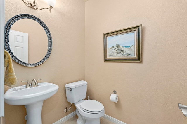 bathroom featuring toilet and sink