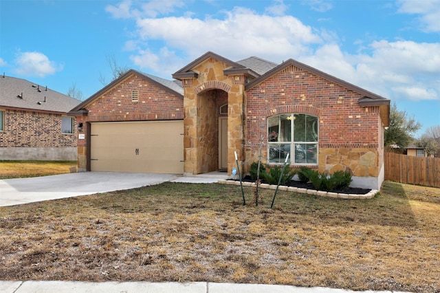 view of front property with a front lawn and a garage