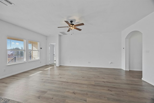 spare room with ceiling fan and hardwood / wood-style floors