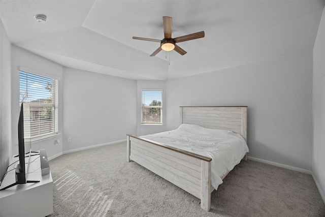 bedroom featuring ceiling fan, light carpet, and lofted ceiling