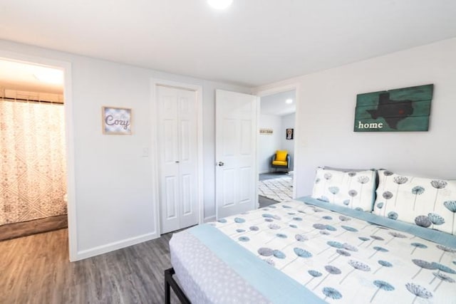 bedroom with hardwood / wood-style floors and a closet