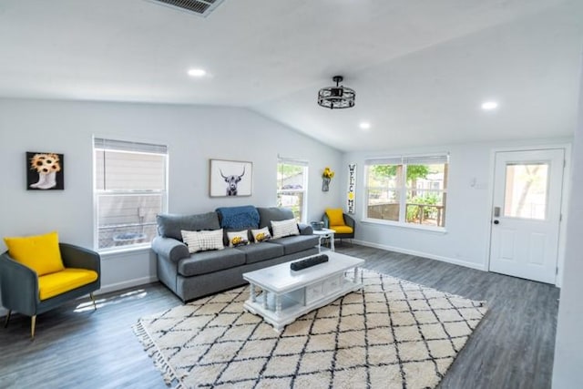 living room featuring hardwood / wood-style floors and vaulted ceiling