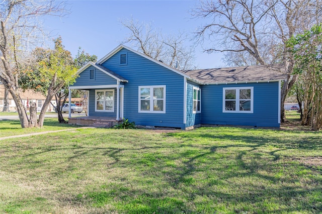 ranch-style home with a front yard