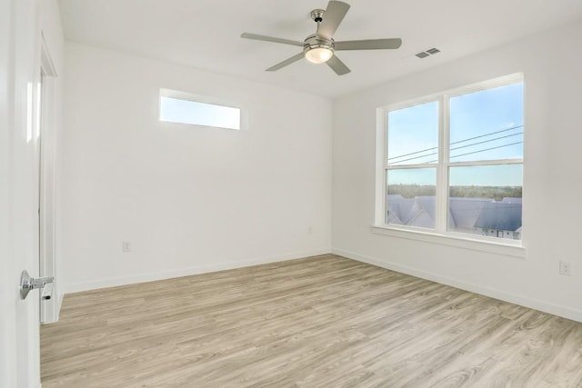 4801 Springdale Rd Unit 2311, Austin, TX 78723 - spare room with healthy amount of natural light, light wood-type flooring, and ceiling fan