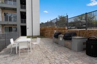 4801 Springdale Rd Unit 2311, Austin, TX 78723 - view of patio featuring outdoor dining space