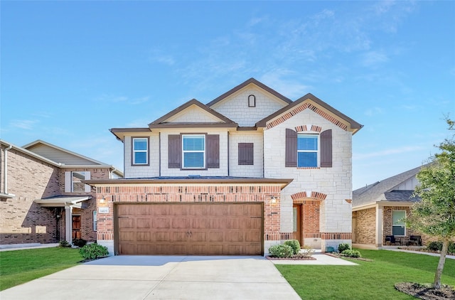 view of front of property with a garage and a front lawn