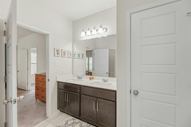 bathroom featuring a wealth of natural light and vanity