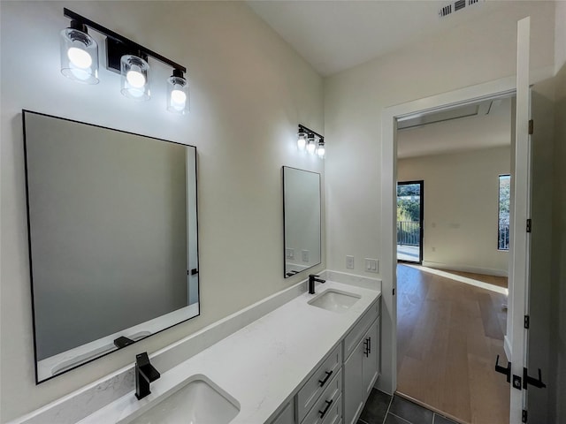 bathroom with vanity and tile patterned floors