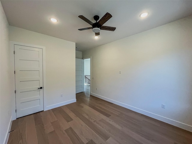 unfurnished bedroom featuring wood-type flooring and ceiling fan