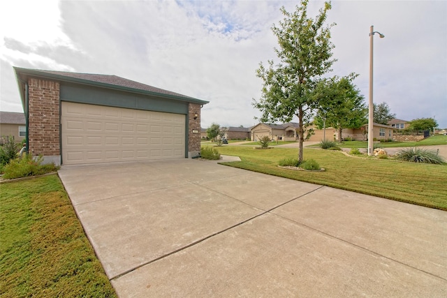 garage featuring a lawn