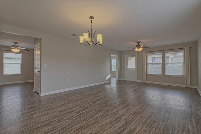 unfurnished living room featuring dark hardwood / wood-style floors and ceiling fan with notable chandelier