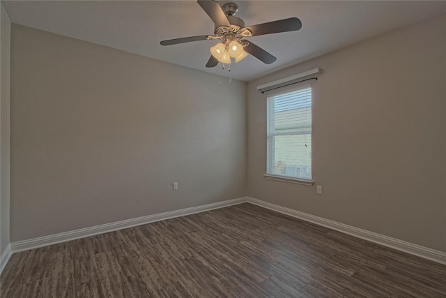 empty room with ceiling fan and dark hardwood / wood-style floors