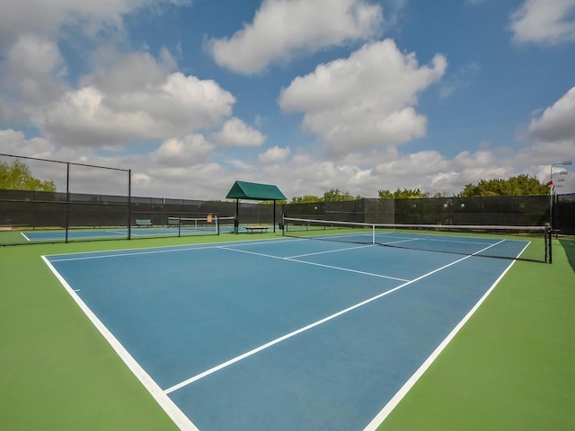 view of sport court with basketball hoop