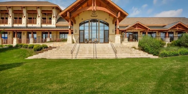 rear view of house with a lawn