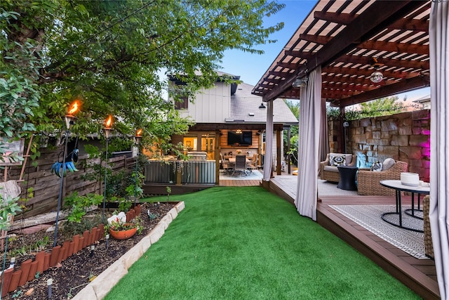 view of yard featuring an outdoor living space, a deck, and a pergola