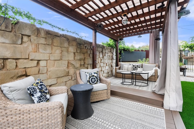 view of patio featuring a wooden deck, outdoor lounge area, and a pergola