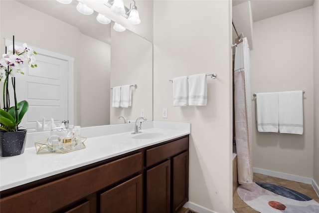 bathroom featuring shower / tub combo, vanity, and tile patterned floors