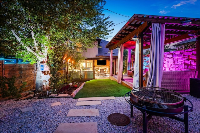 view of yard with a fire pit