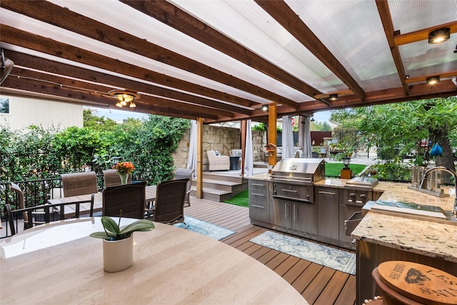 wooden deck featuring area for grilling