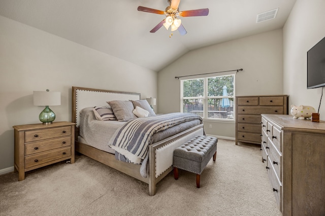 carpeted bedroom featuring ceiling fan and vaulted ceiling