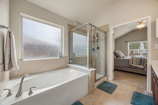 bathroom with lofted ceiling, ceiling fan, separate shower and tub, and tile patterned floors