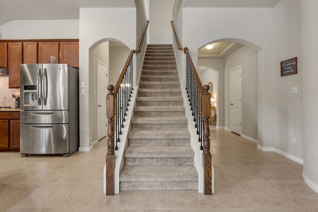 stairs with tile patterned floors