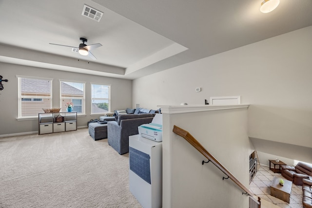 interior space with light carpet and ceiling fan