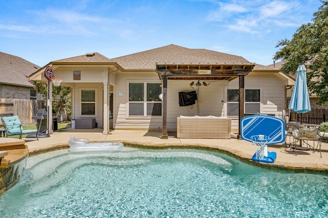 back of house with a pergola, a patio, and a fenced in pool