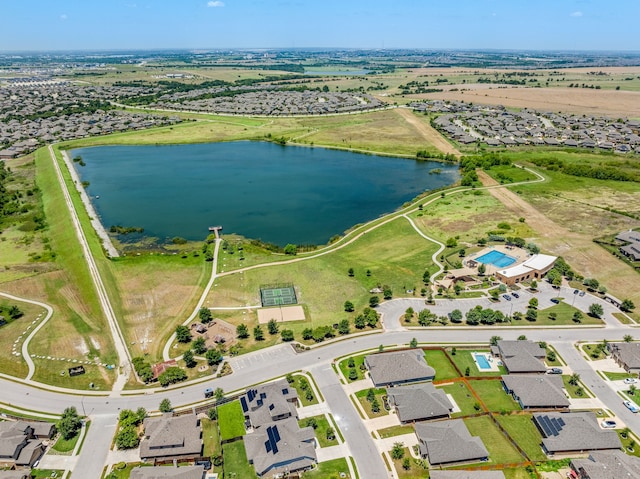 birds eye view of property with a water view