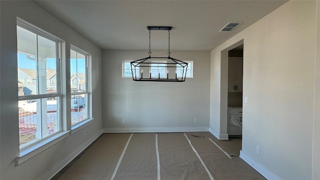 unfurnished dining area with plenty of natural light