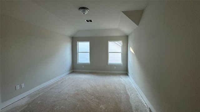 additional living space featuring vaulted ceiling