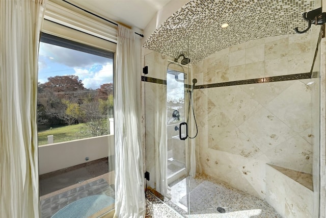 bathroom with a tile shower