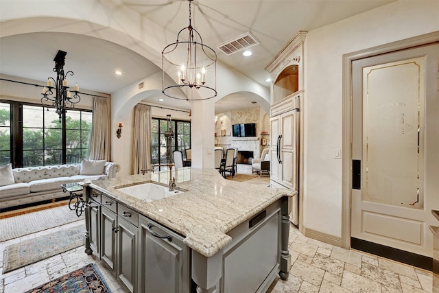 2433 Westlake Dr, Austin, TX 78746 - kitchen featuring a chandelier, arched walkways, a sink, open floor plan, and recessed lighting