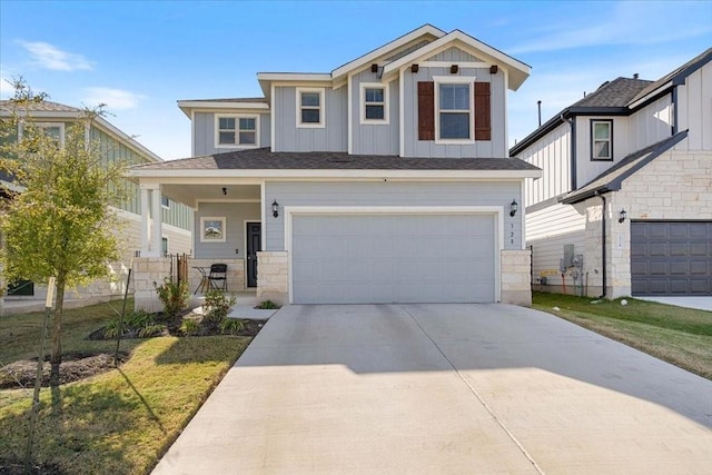 view of front of home featuring a front yard and a garage