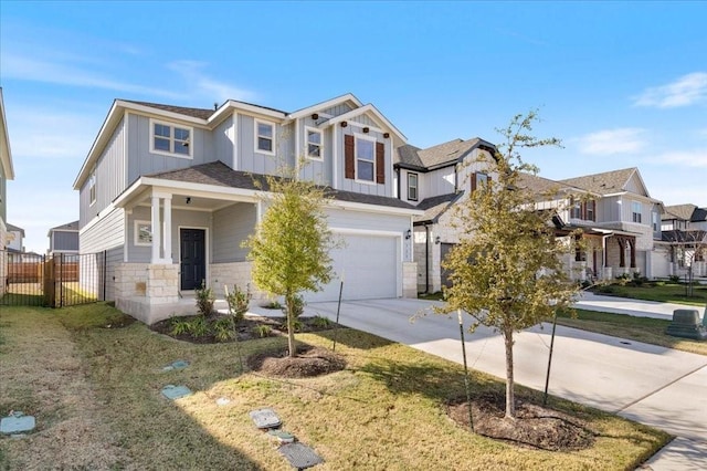 view of front of home with a front lawn and a garage