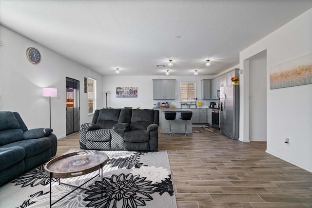 living room with hardwood / wood-style floors and a wealth of natural light