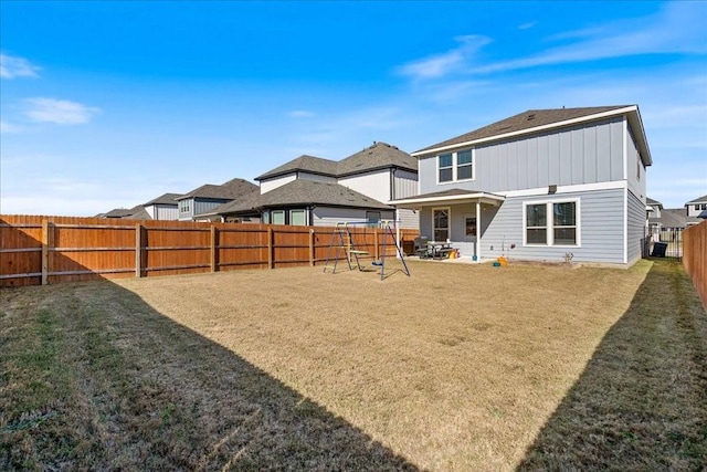 back of property featuring a yard and a patio