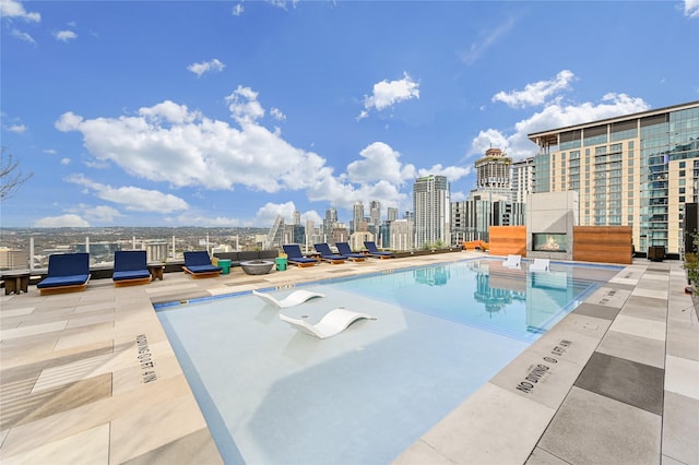 view of swimming pool featuring a patio area