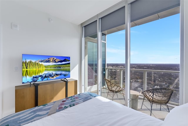 bedroom featuring a wall of windows