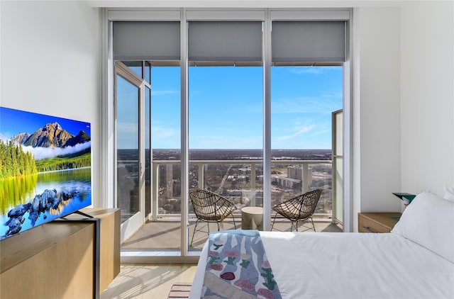 bedroom with floor to ceiling windows